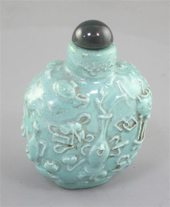 A Chinese turquoise glazed and moulded snuff bottle, 19th century, height 6.2cm